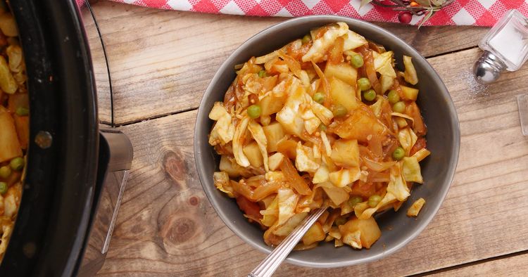 Slow cooker cabbage curry in a bowl with rice