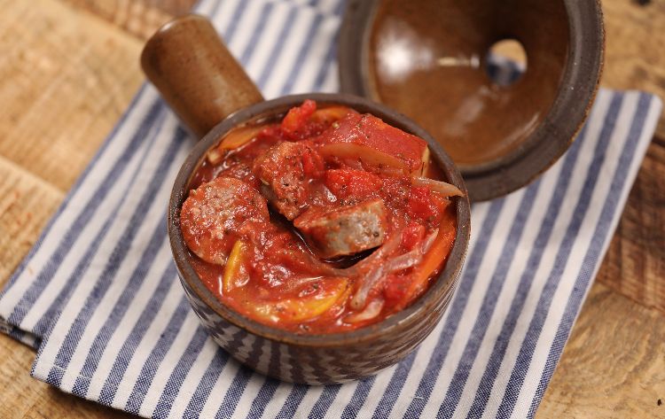 Sausage and potato casserole with bell peppers in tomato sauce